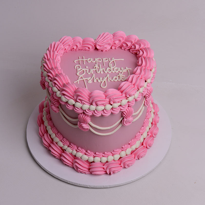 heart shape pink vintage birthday cake with hand written text