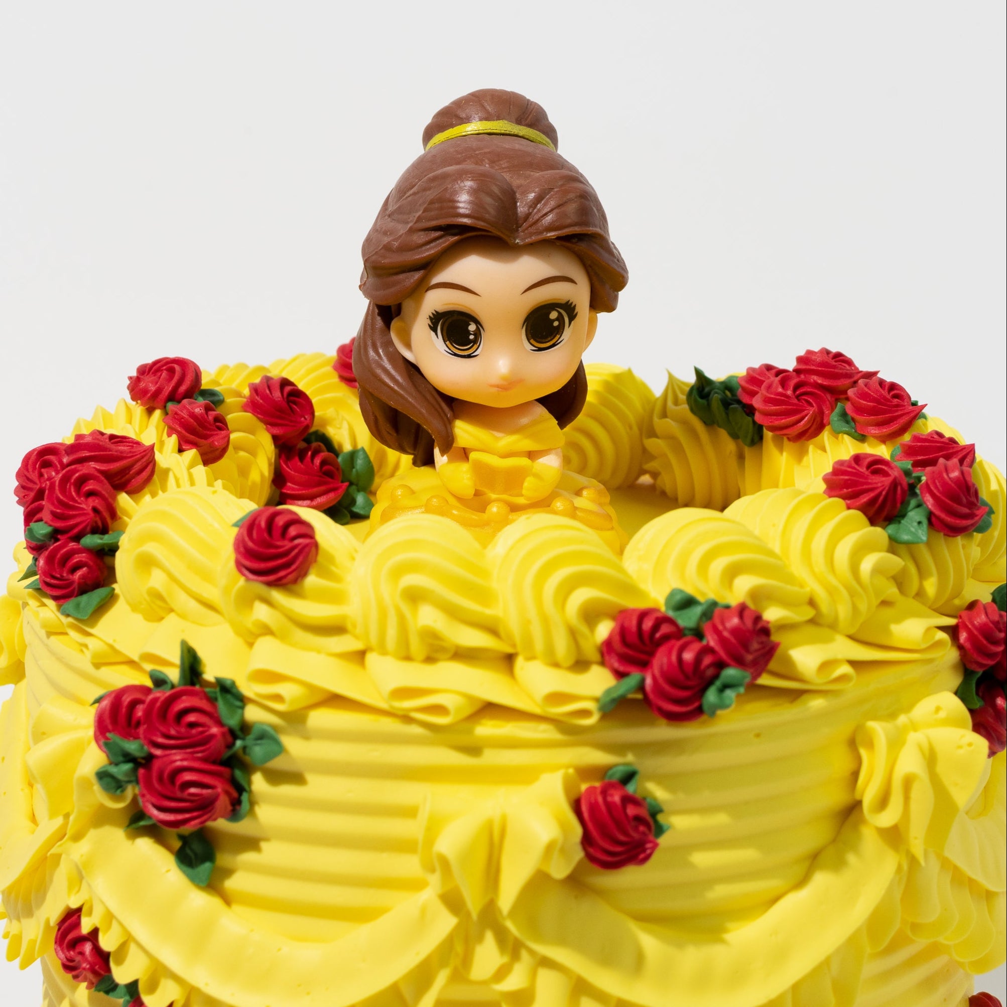 Luxury Disney Princess Belle-inspired cake. Belle figurine topper. Beauty and the Beast theme.