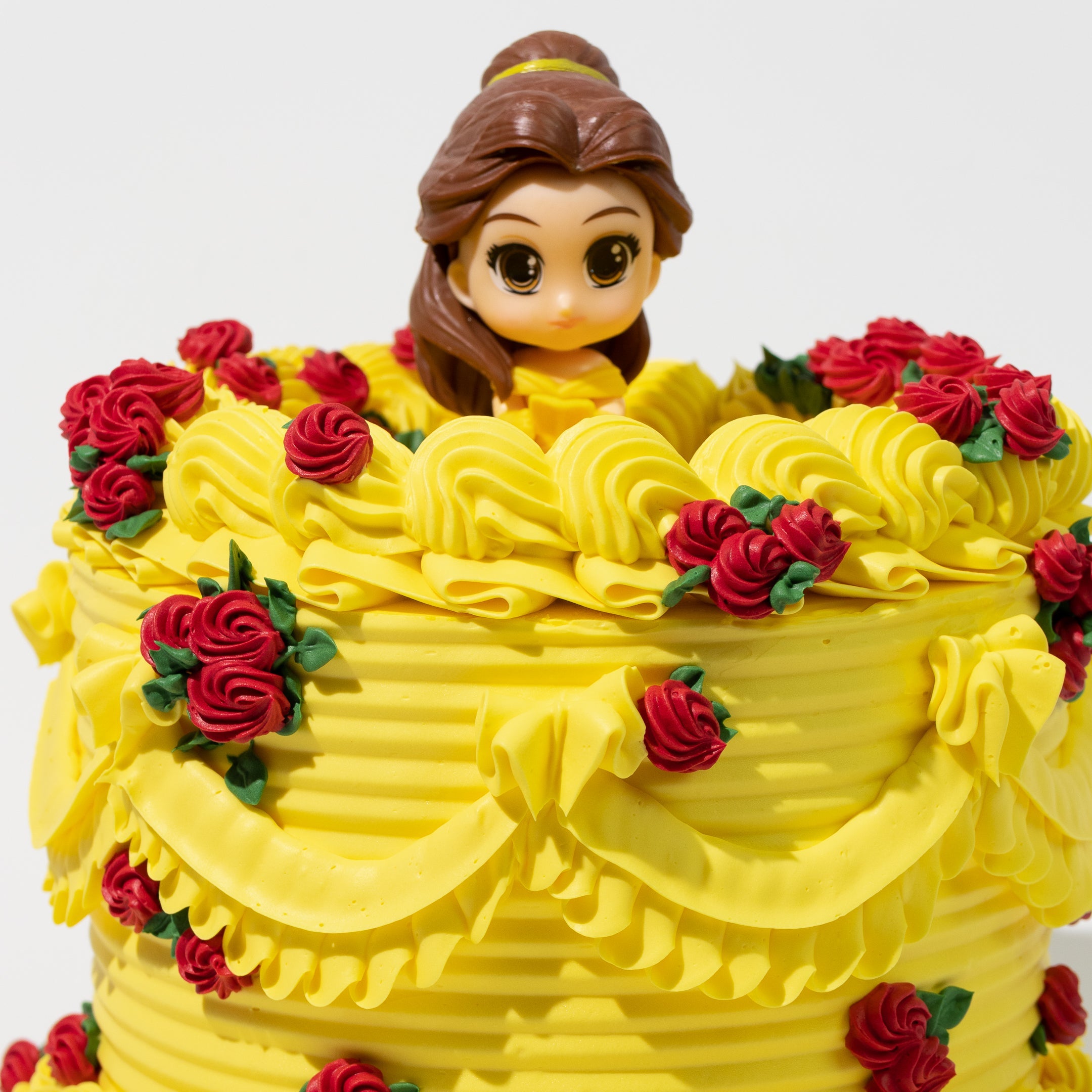 Luxury Disney Princess Belle-inspired cake. Belle figurine topper. Beauty and the Beast theme.